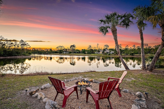 view of water feature with an outdoor fire pit