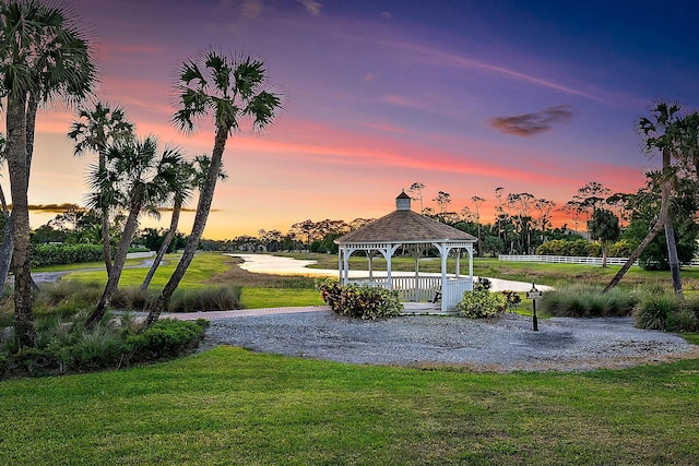 surrounding community featuring a gazebo and a lawn