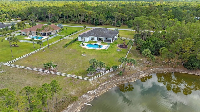 aerial view featuring a water view and a forest view