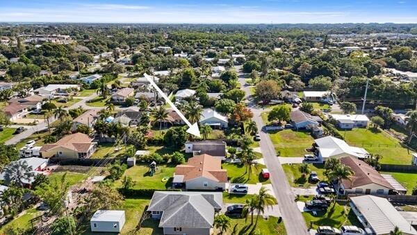 birds eye view of property with a residential view