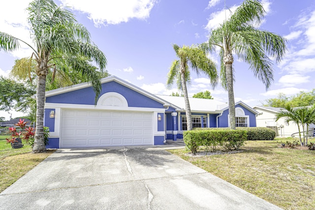 1142 SW Dalton Ave, Port Saint Lucie, FL 34953 - single story home with an attached garage, concrete driveway, stucco siding, and a front yard
