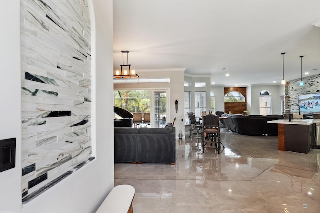 19361 W Sycamore Dr, The Acreage, FL 33470 - living area with ornamental molding, recessed lighting, and marble finish floor