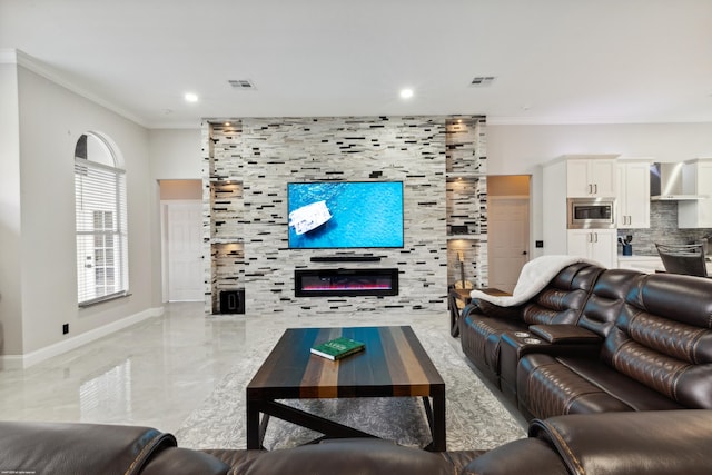19361 W Sycamore Dr, The Acreage, FL 33470 - living room featuring a large fireplace, baseboards, ornamental molding, and visible vents