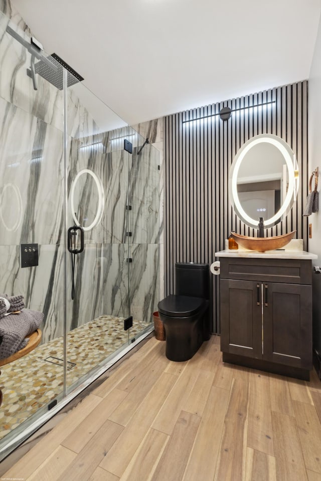 19361 W Sycamore Dr, The Acreage, FL 33470 - full bath featuring a marble finish shower, toilet, vanity, and wood finished floors