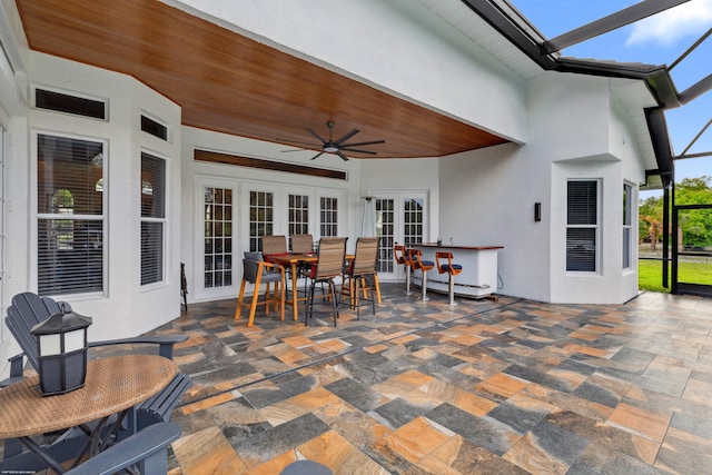 19361 W Sycamore Dr, The Acreage, FL 33470 - view of patio featuring french doors, ceiling fan, outdoor dining area, and a lanai
