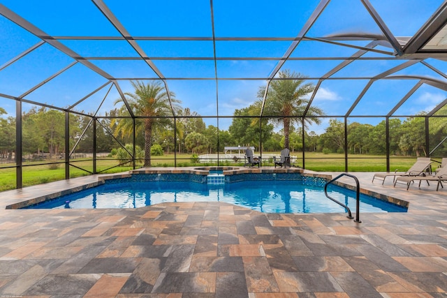 19361 W Sycamore Dr, The Acreage, FL 33470 - view of swimming pool featuring a patio, a pool with connected hot tub, and glass enclosure
