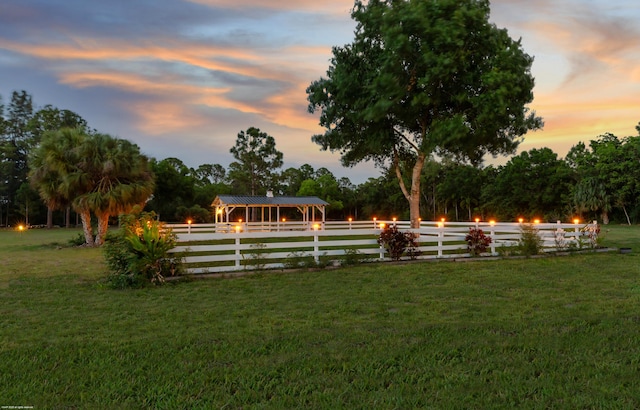 19361 W Sycamore Dr, The Acreage, FL 33470 - yard at dusk with fence