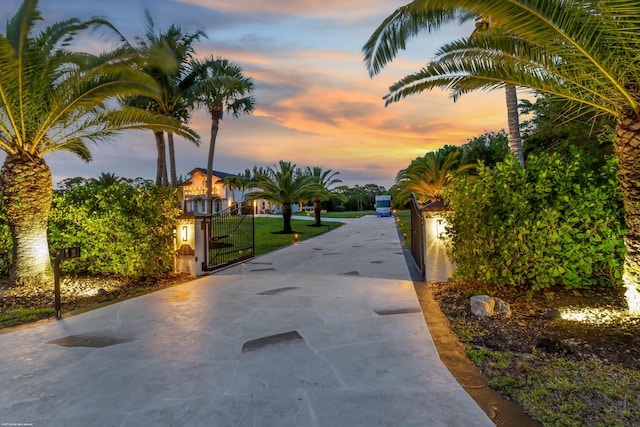 19361 W Sycamore Dr, The Acreage, FL 33470 - view of street with concrete driveway, a gated entry, and a gate