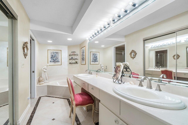 15310 Strathearn Dr Unit 11504, Delray Beach, FL 33446 - bathroom featuring a bath, a sink, double vanity, recessed lighting, and tile patterned flooring