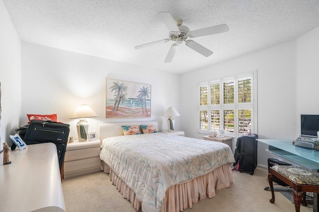 15310 Strathearn Dr Unit 11504, Delray Beach, FL 33446 - bedroom with a textured ceiling, a ceiling fan, and light carpet