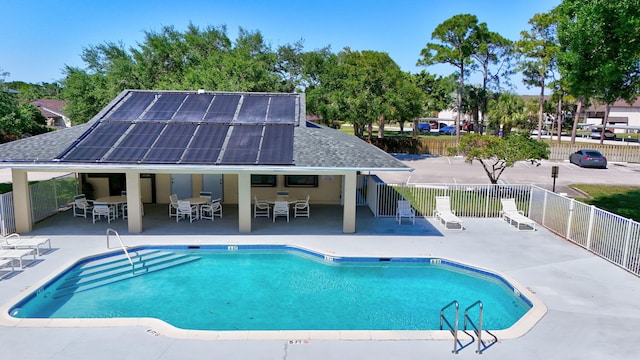 6551 SE Federal Hwy Unit 203, Stuart, FL 34997 - community pool with outdoor dining space, a patio area, and fence