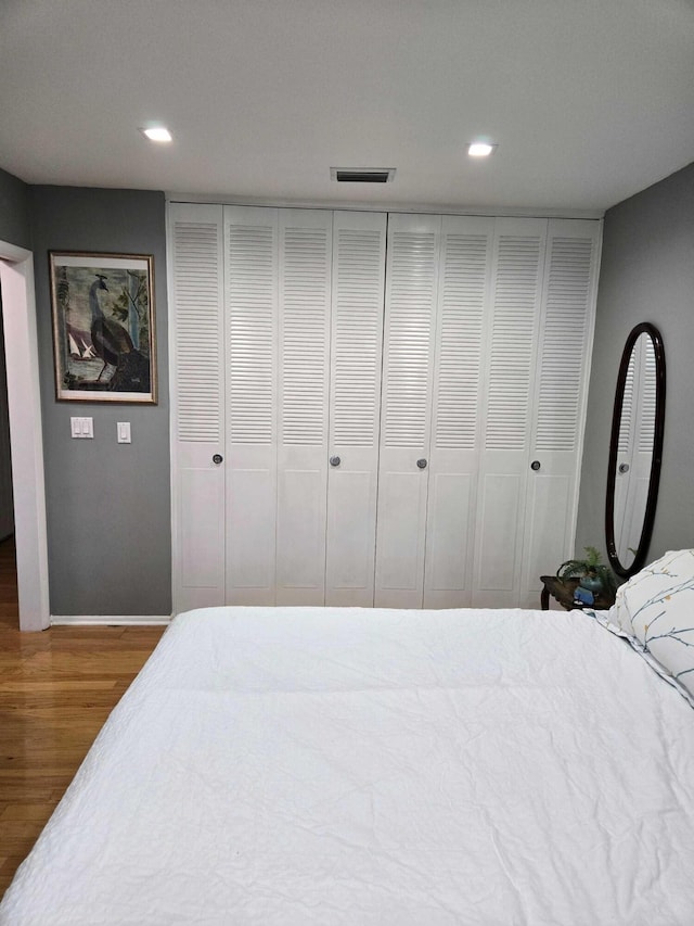 2970 E Ashley Dr E Unit B, West Palm Beach, FL 33415 - bedroom featuring wood finished floors, recessed lighting, and baseboards