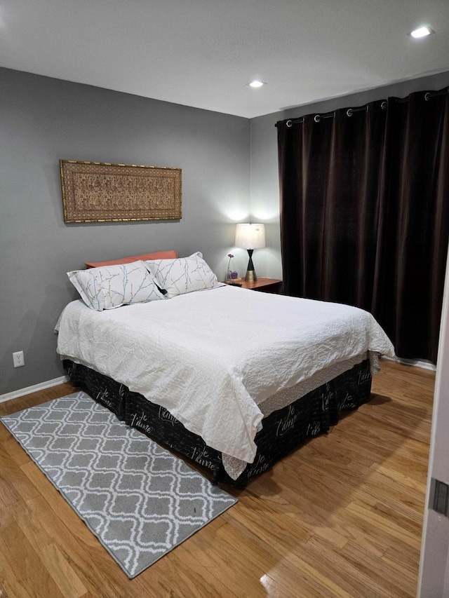 2970 E Ashley Dr E Unit B, West Palm Beach, FL 33415 - bedroom featuring wood finished floors, recessed lighting, and baseboards