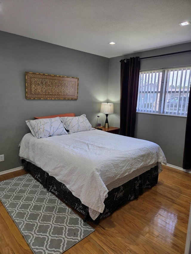 2970 E Ashley Dr E Unit B, West Palm Beach, FL 33415 - bedroom featuring wood finished floors, baseboards, and recessed lighting