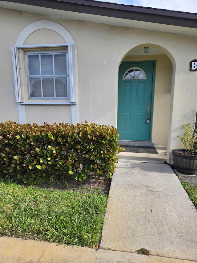 2970 E Ashley Dr E Unit B, West Palm Beach, FL 33415 - property entrance with stucco siding