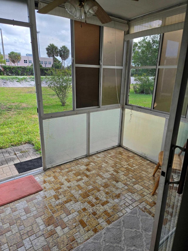 2970 E Ashley Dr E Unit B, West Palm Beach, FL 33415 - unfurnished sunroom with ceiling fan