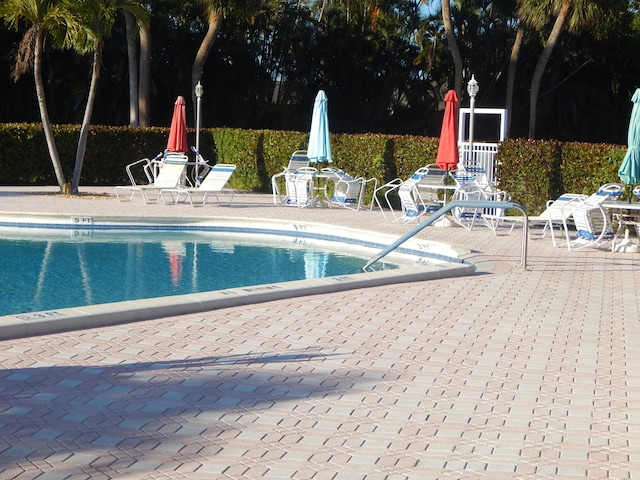 2970 E Ashley Dr E Unit B, West Palm Beach, FL 33415 - community pool with a patio