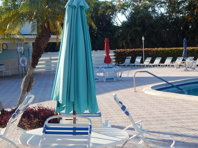 2970 E Ashley Dr E Unit B, West Palm Beach, FL 33415 - community pool featuring a patio area