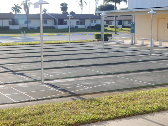 2970 E Ashley Dr E Unit B, West Palm Beach, FL 33415 - view of community with shuffleboard and a residential view