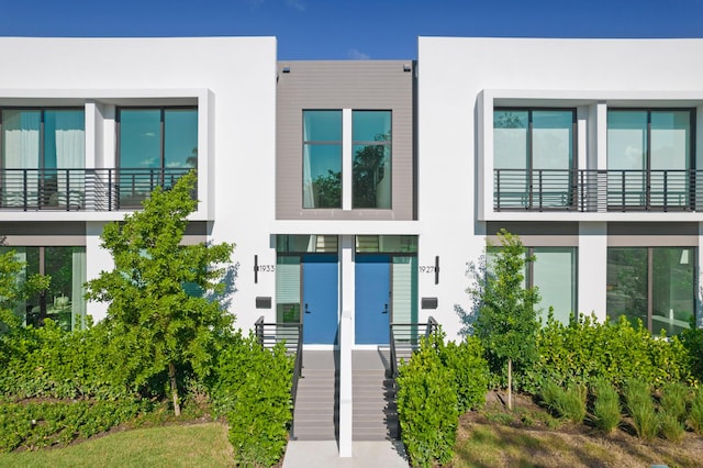 1967 Dock St, West Palm Beach, FL 33401 - view of front of home with stucco siding and stairs