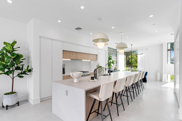 1967 Dock St, West Palm Beach, FL 33401 - kitchen featuring modern cabinets, concrete flooring, a large island, and recessed lighting