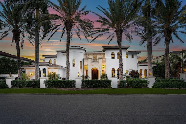 251 W Coconut Palm Rd, Boca Raton, FL 33432 - view of front facade with stucco siding, a balcony, and stone siding