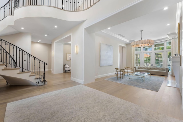 251 W Coconut Palm Rd, Boca Raton, FL 33432 - foyer entrance with baseboards, a chandelier, wood finished floors, and stairway