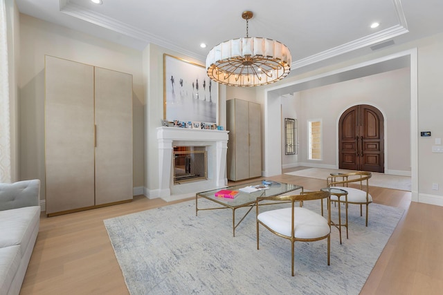 251 W Coconut Palm Rd, Boca Raton, FL 33432 - living area with a raised ceiling, ornamental molding, and light wood finished floors