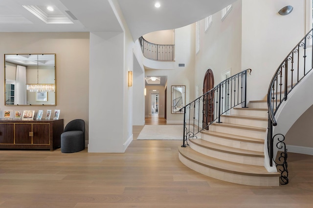 251 W Coconut Palm Rd, Boca Raton, FL 33432 - foyer with stairs, recessed lighting, baseboards, wood finished floors, and a towering ceiling