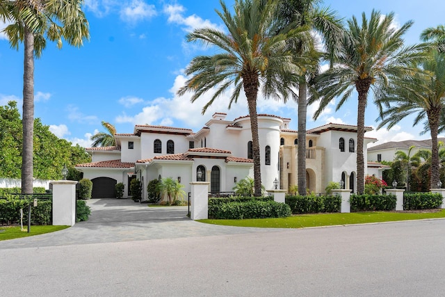 251 W Coconut Palm Rd, Boca Raton, FL 33432 - mediterranean / spanish-style home featuring stucco siding, driveway, and a tiled roof