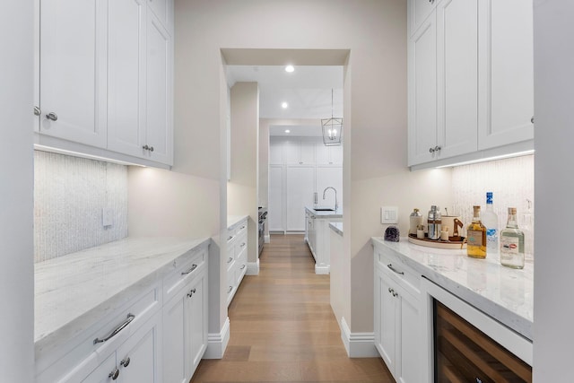 251 W Coconut Palm Rd, Boca Raton, FL 33432 - bar with a sink, a bar, light wood finished floors, beverage cooler, and recessed lighting