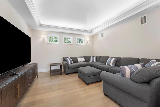 251 W Coconut Palm Rd, Boca Raton, FL 33432 - living room with visible vents, ornamental molding, a raised ceiling, and light wood-style floors