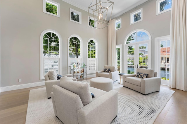251 W Coconut Palm Rd, Boca Raton, FL 33432 - interior space featuring french doors and an inviting chandelier