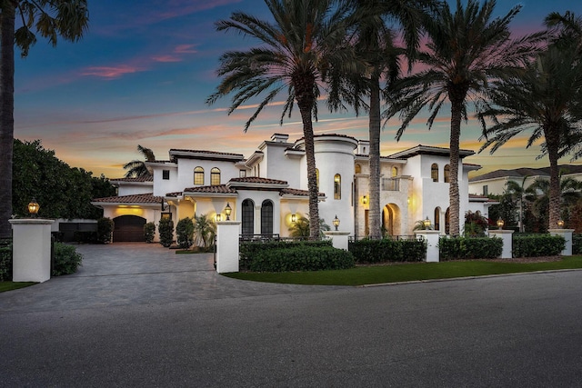 251 W Coconut Palm Rd, Boca Raton, FL 33432 - mediterranean / spanish-style house featuring a tile roof, driveway, a balcony, and stucco siding