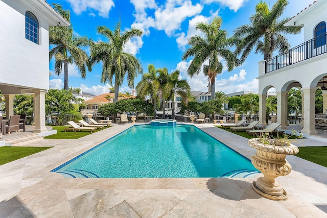 251 W Coconut Palm Rd, Boca Raton, FL 33432 - view of pool featuring a patio area, a pool with connected hot tub, and a residential view