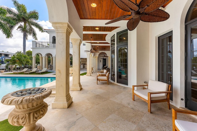 251 W Coconut Palm Rd, Boca Raton, FL 33432 - view of patio featuring ceiling fan, an outdoor pool, and a balcony