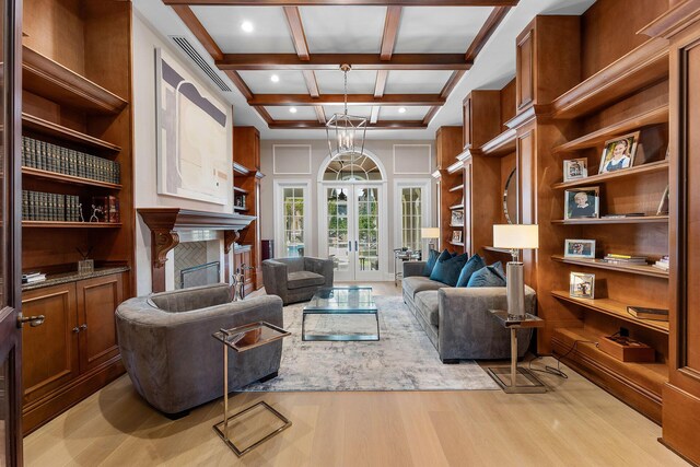 251 W Coconut Palm Rd, Boca Raton, FL 33432 - living room featuring french doors, light wood-style flooring, a tile fireplace, visible vents, and coffered ceiling