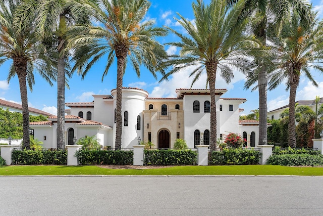 251 W Coconut Palm Rd, Boca Raton, FL 33432 - view of front of house featuring fence private yard, stucco siding, and a tile roof