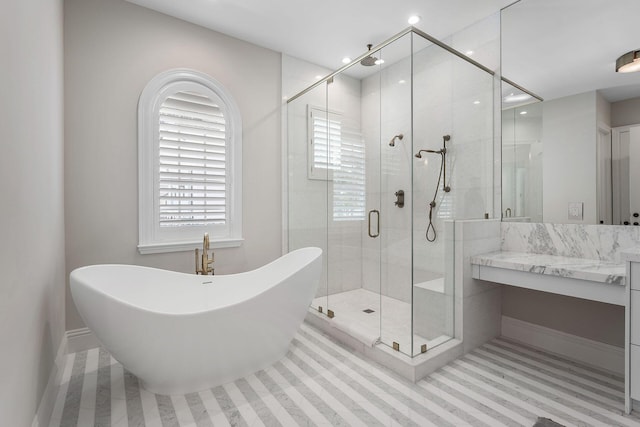 251 W Coconut Palm Rd, Boca Raton, FL 33432 - full bathroom featuring vanity, a freestanding bath, a healthy amount of sunlight, and a shower stall