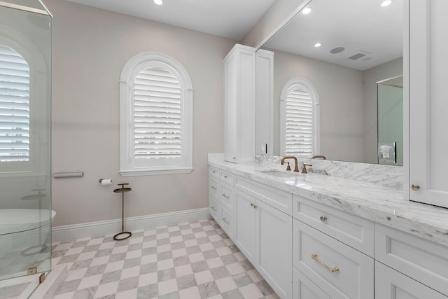 251 W Coconut Palm Rd, Boca Raton, FL 33432 - bathroom featuring baseboards, plenty of natural light, tile patterned floors, and vanity