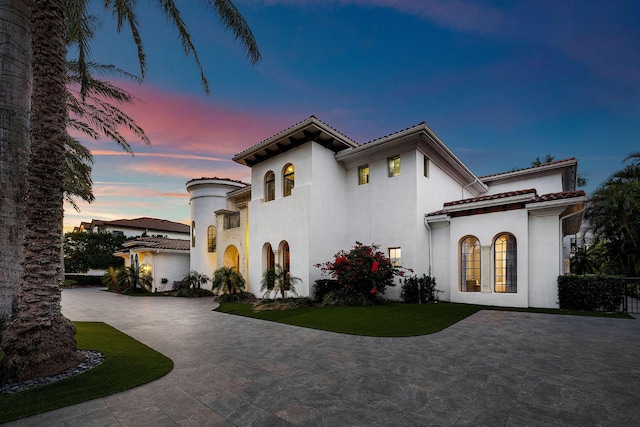 251 W Coconut Palm Rd, Boca Raton, FL 33432 - mediterranean / spanish home with curved driveway, stucco siding, and a tile roof