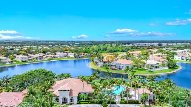 birds eye view of property with a water view and a residential view