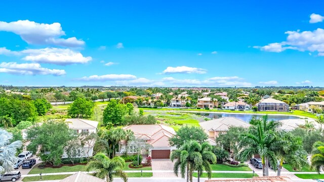 drone / aerial view with a residential view and a water view