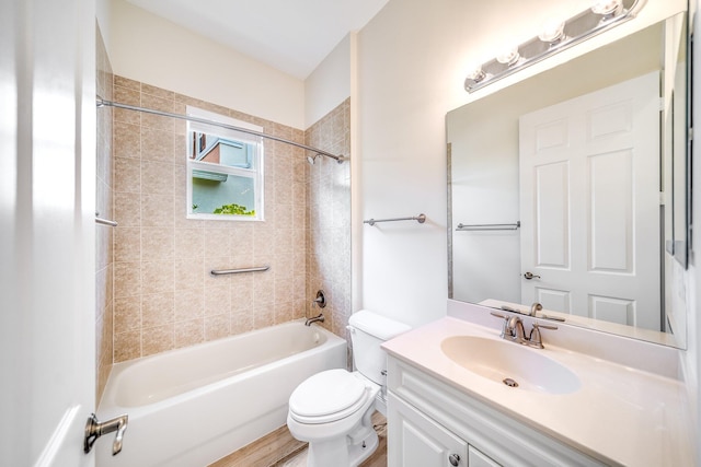 full bathroom featuring washtub / shower combination, toilet, and vanity