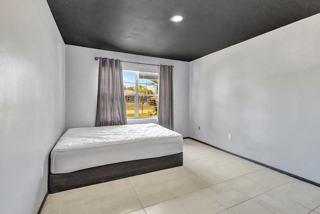 bedroom with recessed lighting and baseboards