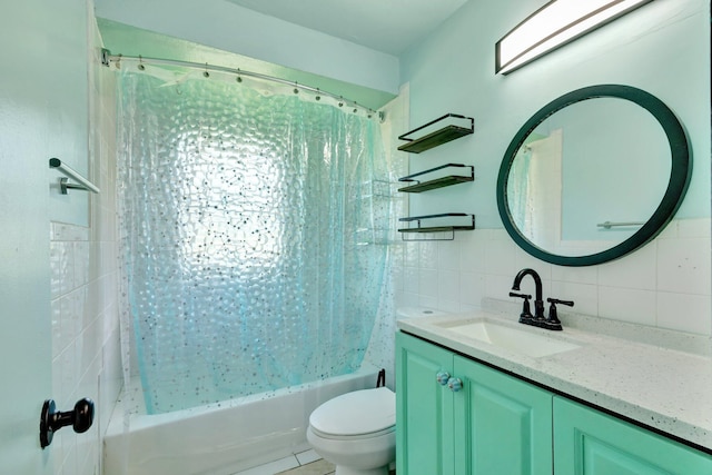 bathroom with shower / bath combination with curtain, vanity, tile walls, and toilet