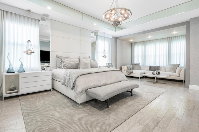 16202 Cabernet Dr, Delray Beach, FL 33446 - bedroom featuring light wood finished floors and a notable chandelier