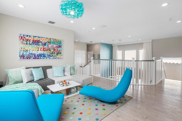 16202 Cabernet Dr, Delray Beach, FL 33446 - living area with visible vents, wood finished floors, and recessed lighting
