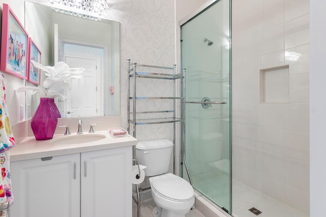 16202 Cabernet Dr, Delray Beach, FL 33446 - bathroom with wallpapered walls, vanity, toilet, and a stall shower