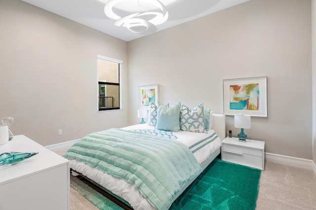 16202 Cabernet Dr, Delray Beach, FL 33446 - carpeted bedroom with baseboards and an inviting chandelier